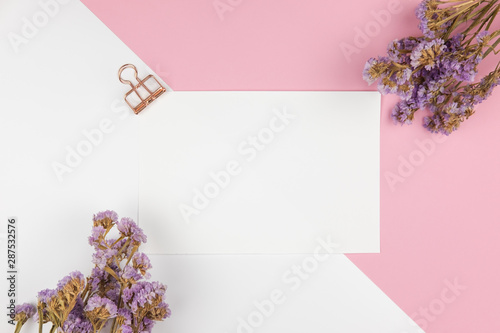 Top view of paper note and purple statice flower