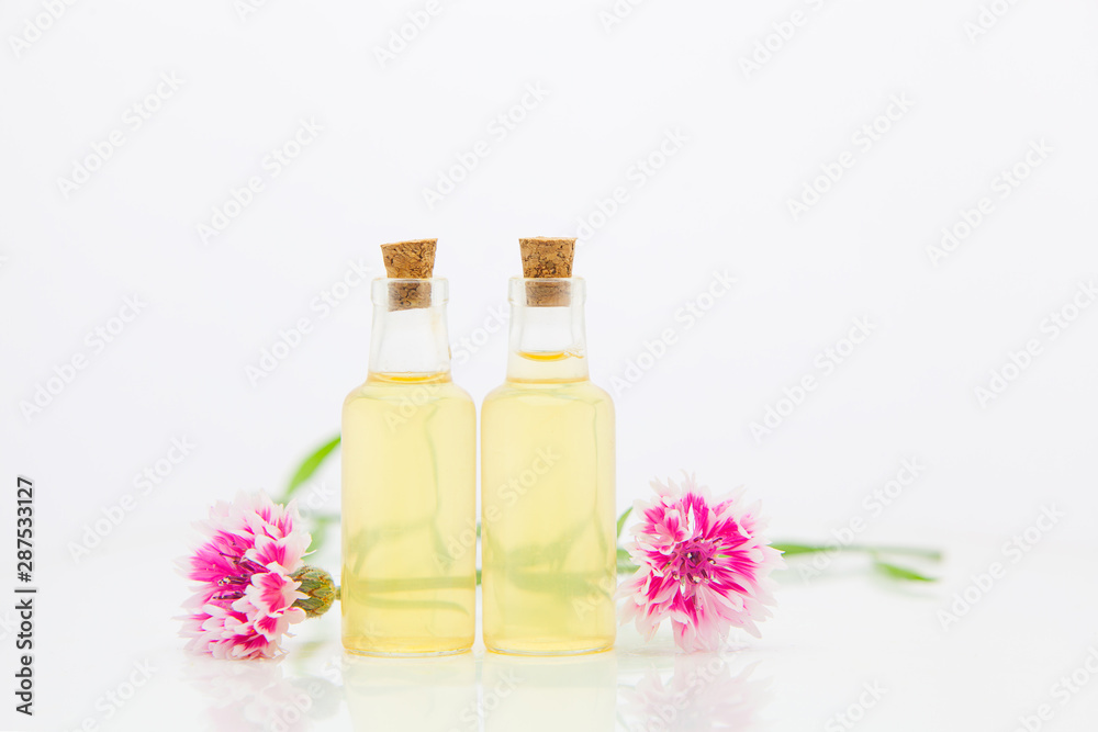 Essence of lavender flowers on White background in beautiful glass Bottle Essence of lavender flowers on White background in beautiful glass Bottle