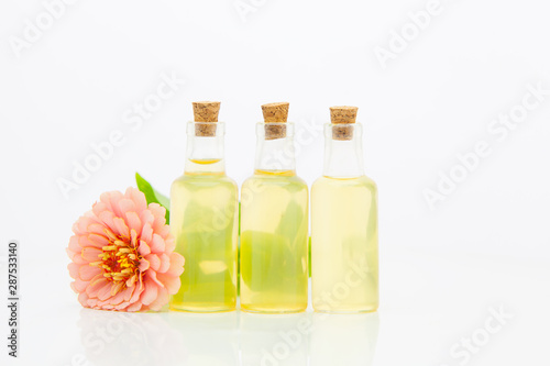 Zinnia essential oil in beautiful bottle on White background