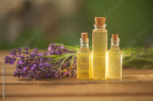 lavender essential oil in beautiful bottle on table