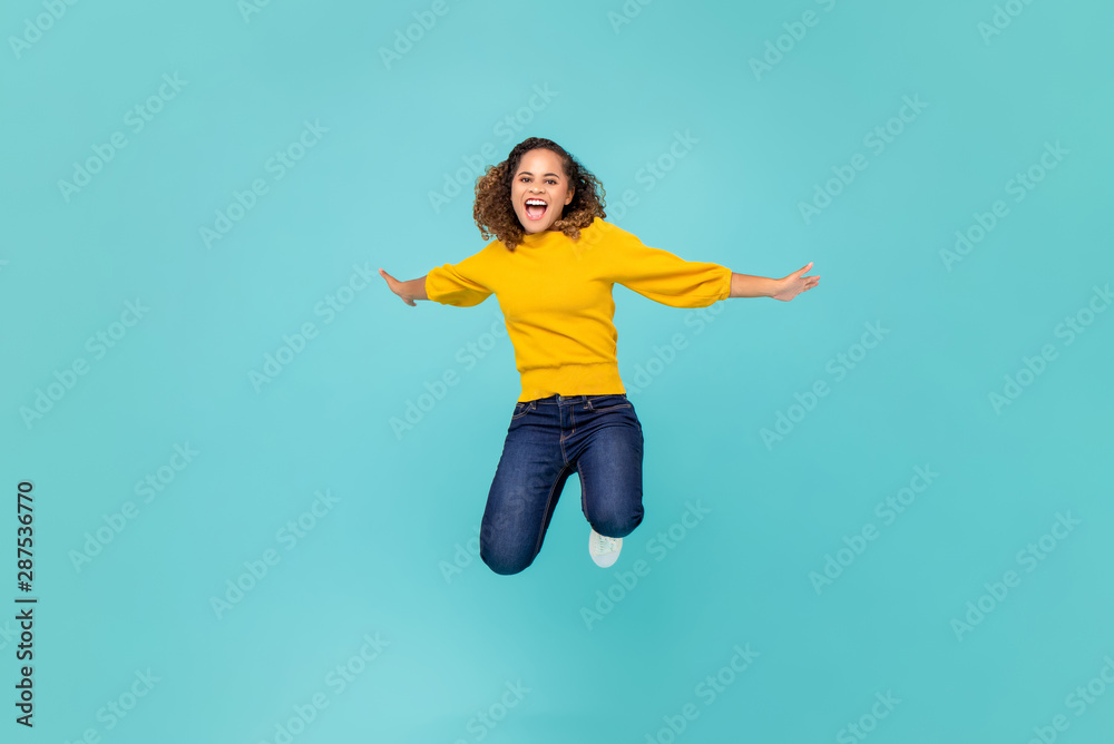 Cheerful African American woman  jumping