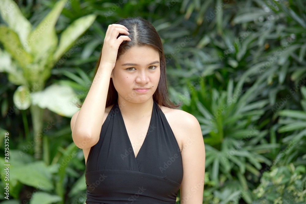 A Youthful Filipina Woman And Confusion