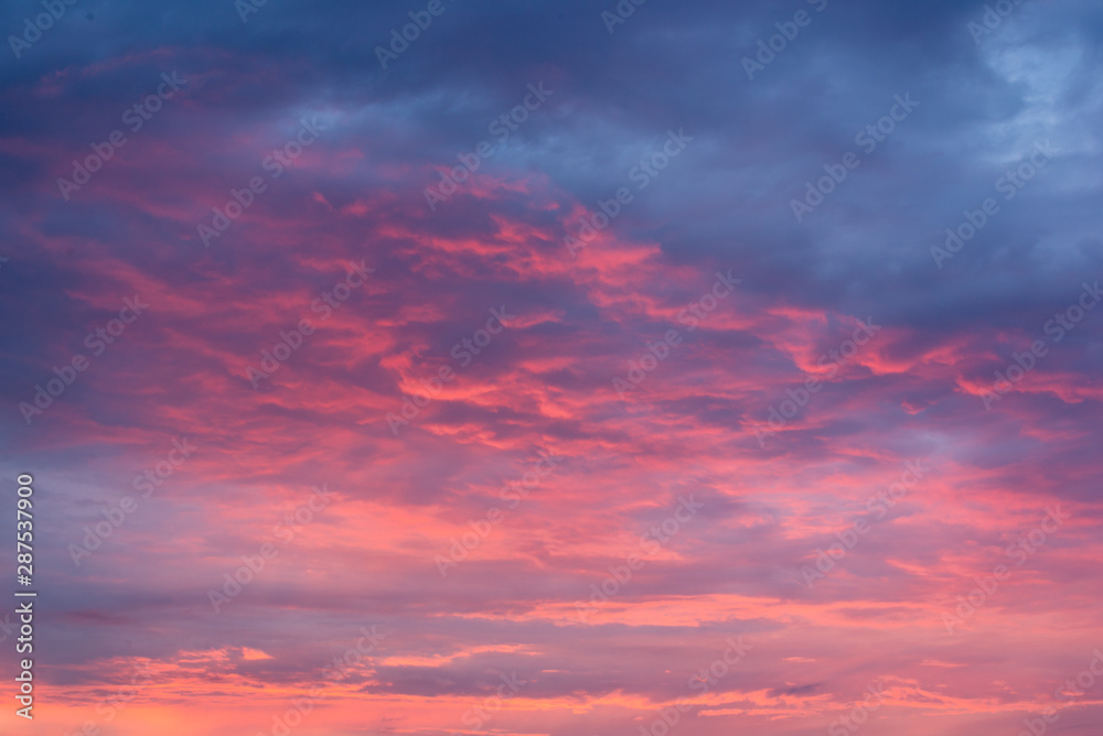 Scarlet sky at sunset with beautiful clouds