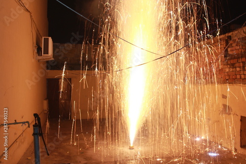 A Flower Pot fire cracker, also known as Anar, is mostly burnt on the night of Diwali releasing a spectacular outburst of sparkles upwards photo