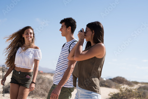 Three young people posing for the camera
