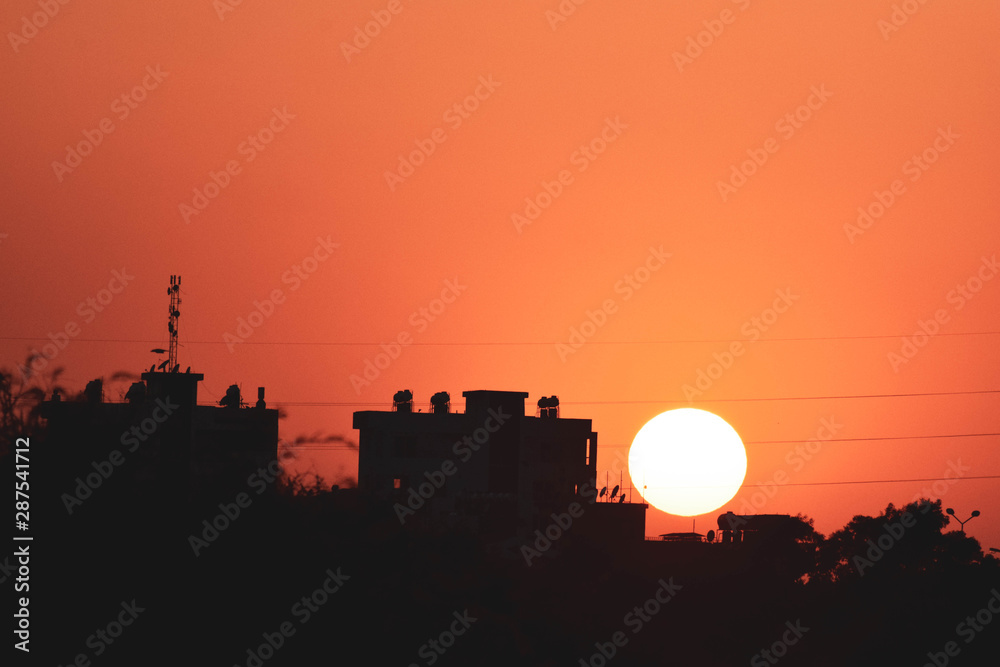 Fototapeta premium Black and orange background, sunset