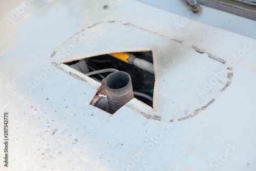 The engine of the car is redone manually. The exhaust pipe sticks out of the hood of the car. photo