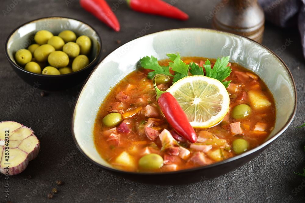 traditional russian meat soup solyanka. The finished dish. Close-up. traditional russian meat soup solyanka. The finished dish. Close-up.