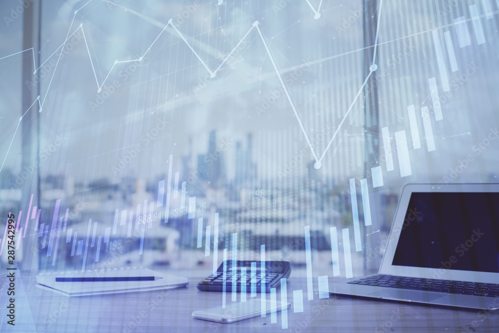 Forex graph hologram on table with computer background. Multi exposure. Concept of financial markets. Forex graph hologram on table with computer background. Multi exposure. Concept of financial markets.