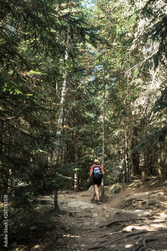 woman hiking in the national park d´aiguestortes in the Pyrenees in Spain