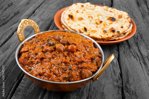 Indian Healthy Cuisine Chana Masala Also Known as Spicy Chickpeas, Channay, Chole Masala or Chholay is a Tasty & Flavourful Curry Made By Cooking Chickpeas in a Spicy Onion Tomato Masala Gravy