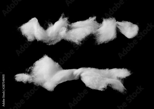 Wadding, absorbent cotton wool isolated on black background, top view