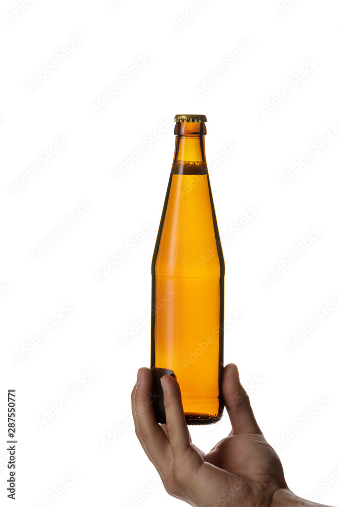 male hand holding brown beer bottle without label isolated on white background male hand holding brown beer bottle without label isolated on white background