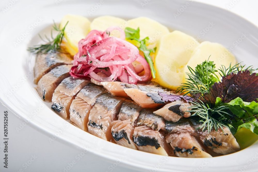 Raw Salted Soused Herring with Onions and Potato Isolated Raw Salted Soused Herring with Onions and Potato Isolated