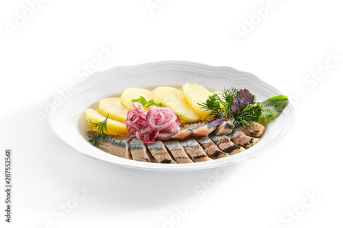 Raw Salted Soused Herring with Onions and Potato Isolated