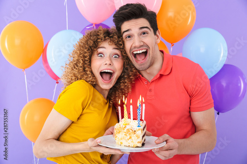 Canvas Print Image of positive couple man and woman celebrating birthday with multicolored ai