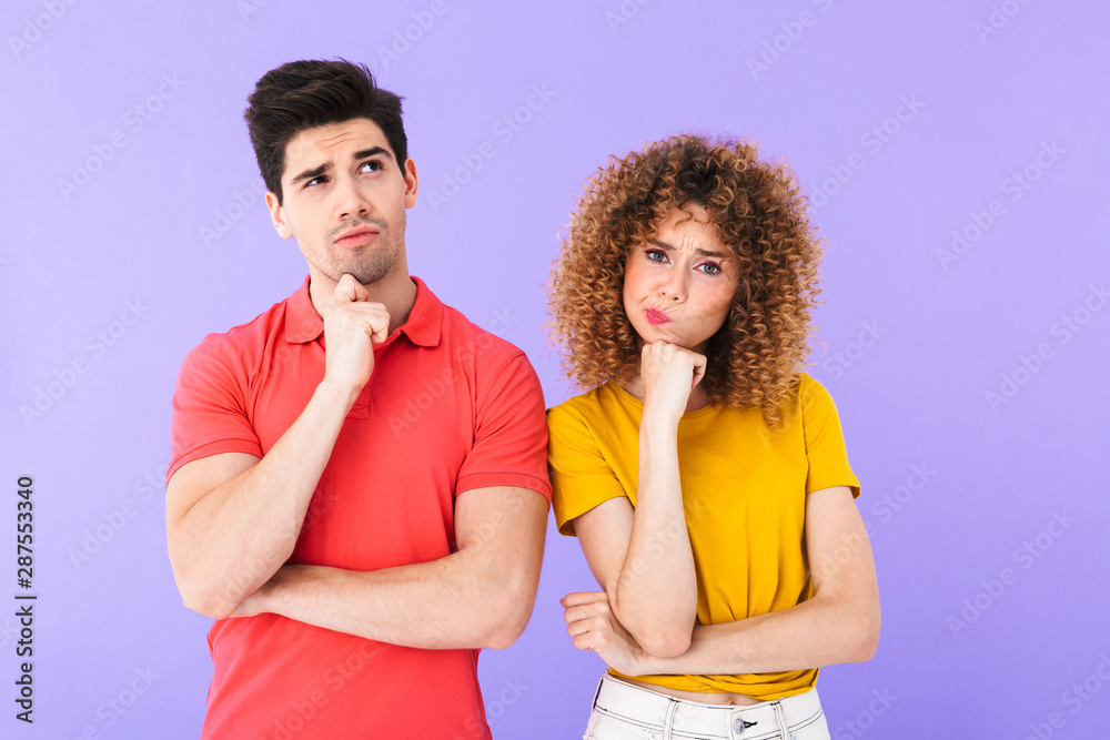 Portrait of thoughtful caucasian people man and woman in basic clothing thinking together with brooding look Portrait of thoughtful caucasian people man and woman in basic clothing thinking together with brooding look