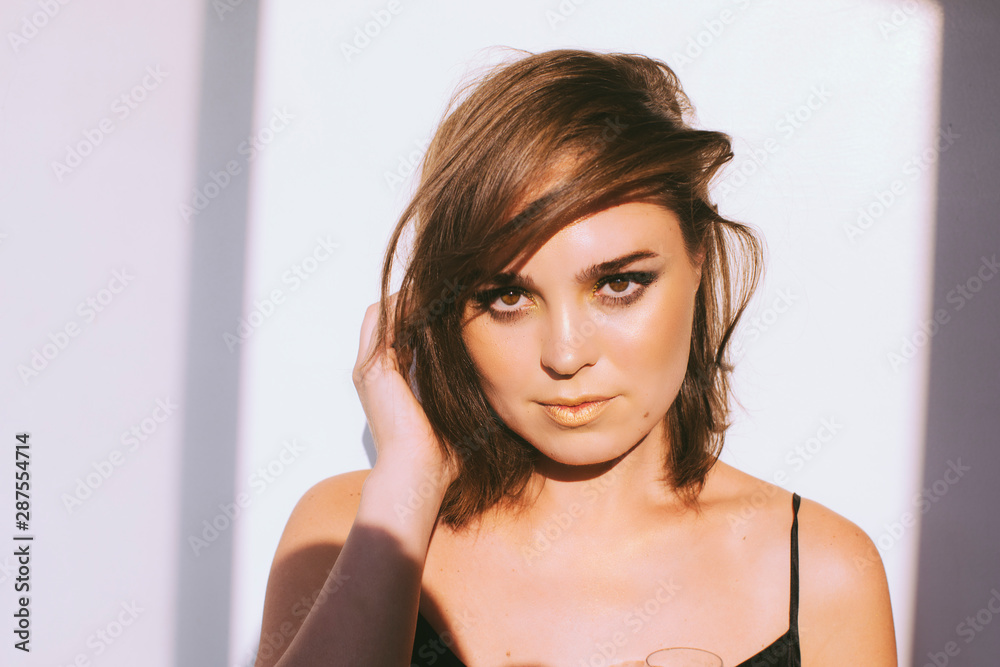 Close up of young beautiful glamorous woman with makeup, cocktail dress, beautiful skin. Close up of young beautiful glamorous woman with makeup, cocktail dress, beautiful skin.