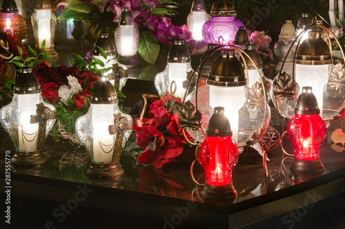 Photography Candles and chrysanthemums at night in the cemetery