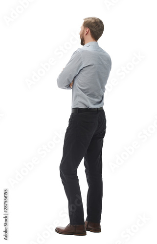 rear view. smiling business man looking at copy space