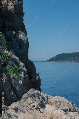 View from a cliff in the sea to the island. Crimea. Black Sea. © Alex Yakunina