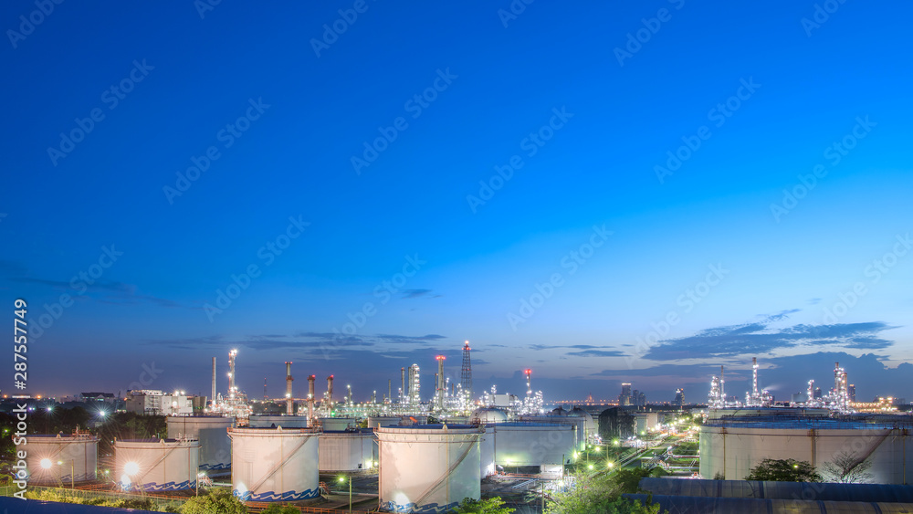 Close up Aerial view at oil and gas industrial,Oil refinery plant form industry,Refinery factory and oil storage tank with twilight. -image