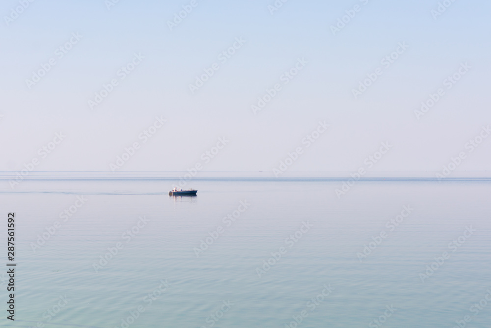 Fishermen in a boat on the lake.