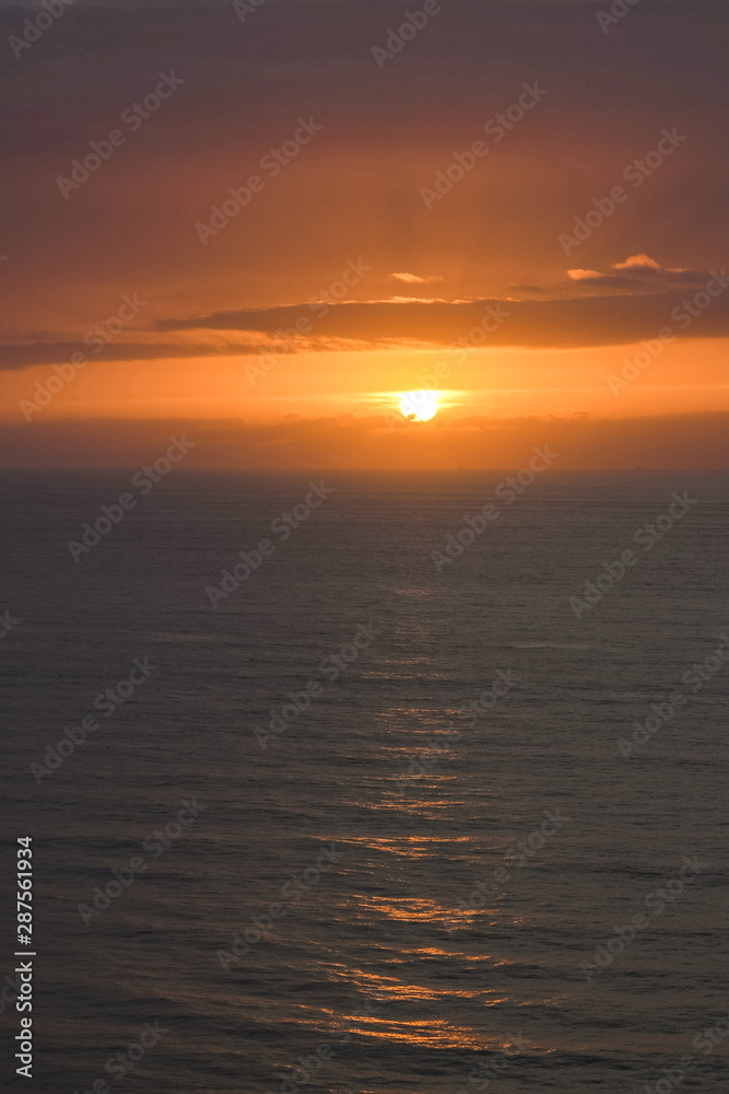 sun at sunset on the horizon in the sea