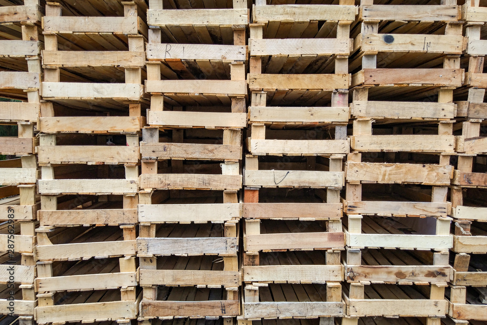 A pile of empty wooden fruit crates A pile of empty wooden fruit crates