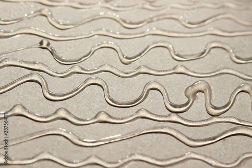 Abstract blurred texture background.  Strange wavy texture. Wavy lines of rubber glue.