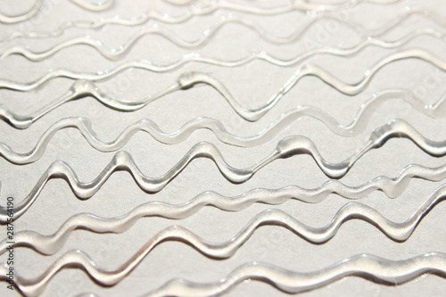 Abstract blurred texture background.  Strange wavy texture. Wavy lines of rubber glue.