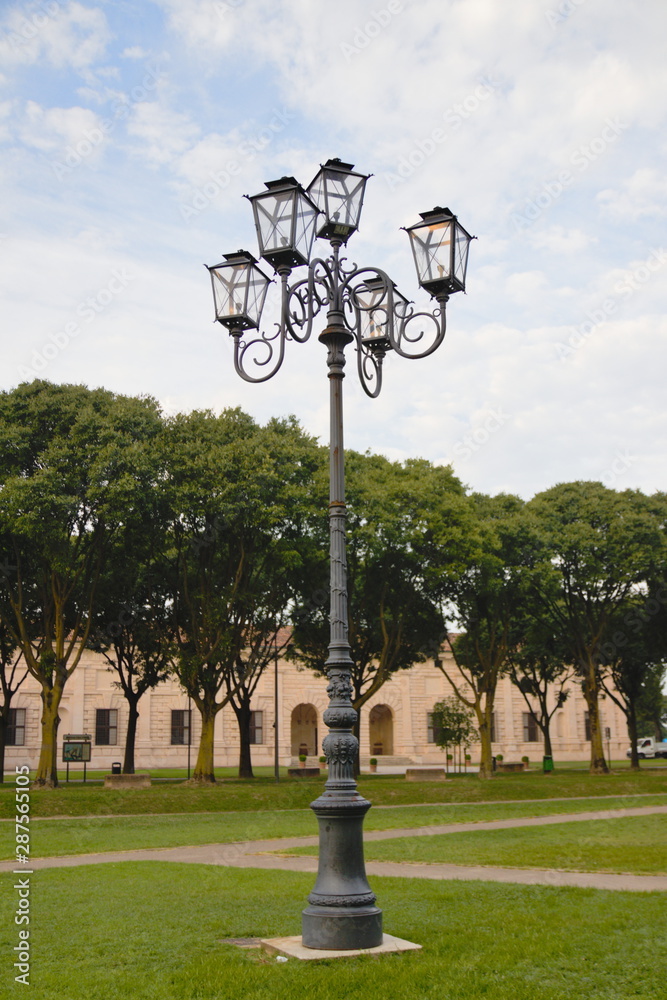 Vintage lantern. Greenery and blue sky