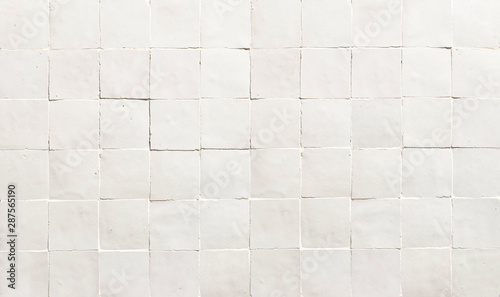 Old retro white ceramic tile texture background. White square tiled wall.
