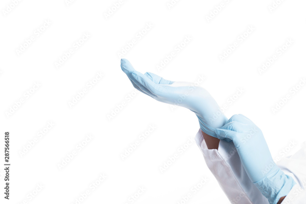 Close up hands doctor in medical coat. Doctor wearing latex gloves Close up hands doctor in medical coat. Doctor wearing latex gloves