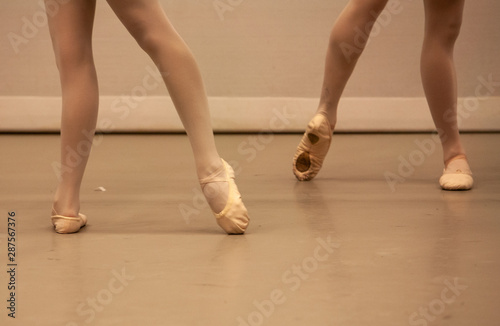 dancers legs in ballet shoes