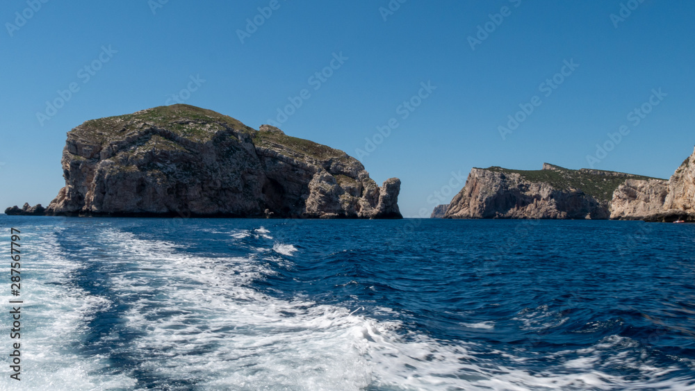 high cliffs in the sea. blue wild water
