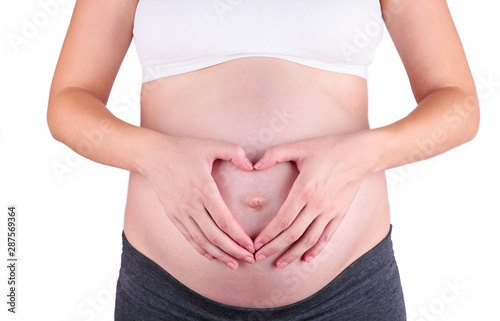 Wallpaper Mural A cute pregnant belly isolated on a white background Torontodigital.ca