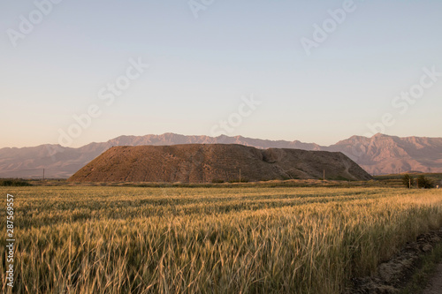 Iraq Kurdistan landscape view of Zagros and ancient mound photo