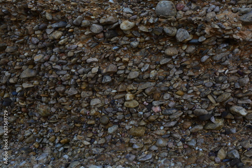 pebble stone texture near the sea on the rocks
