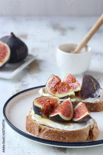 Sandwich with figs and honey, cream cheese,honey and bread slice
