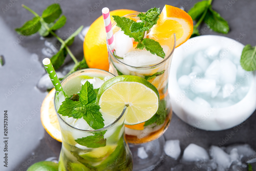 Mohito lime drinks on wooden with blur beach background. Fresh drinks with fruits on wood. Summer concept Mohito lime drinks on wooden with blur beach background. Fresh drinks with fruits on wood. Summer concept