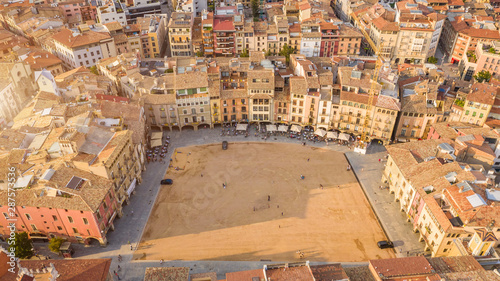 Vic Catalan city main square. Aerial photo. Warm colors. Golden hour sunset light