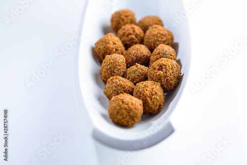 Fantastic and irresistible platter of just-fried falafel balls. Traditional Middle Eastern food.Copy space for text.