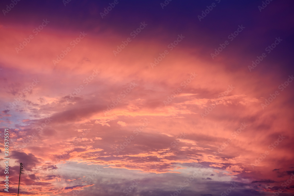 Clouds on sky in pink colours, sunset or sunrise