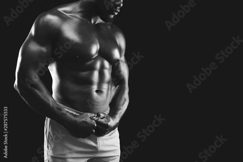 Monochrome photo of black fitness model body