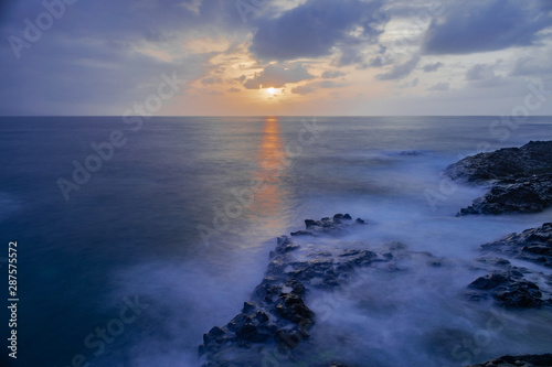 Mesa del Mar volcanic rocks coastline  long exposure photography  Atlantic ocean with sunset light  Tacoronte  Tenerife  Canary islands  Spain
