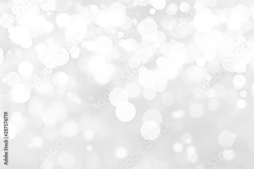 Abstract background with White bokeh on gray background. christmas blurred beautiful shiny Christmas lights.