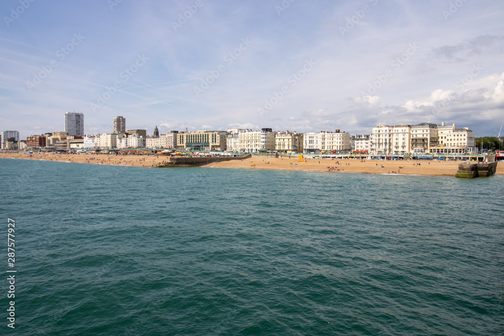 Brighton UK, 10th July 2019: The famous beautiful Brighton Beach and Seafront showing the coastline area on a bright sunny day,