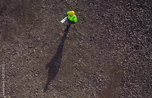 Construction worker from above on gravel photographed