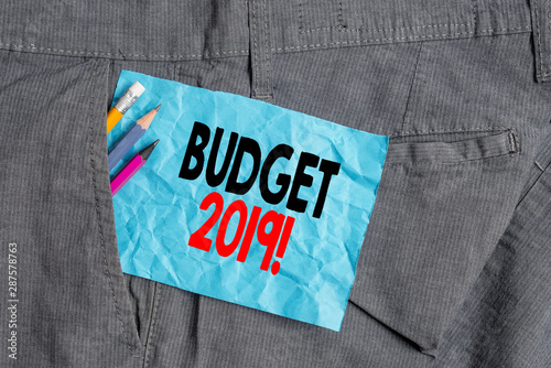 Text sign showing Budget 2019. Business photo showcasing the estimate of income and expenditure for current year Writing equipment and blue note paper inside pocket of man work trousers